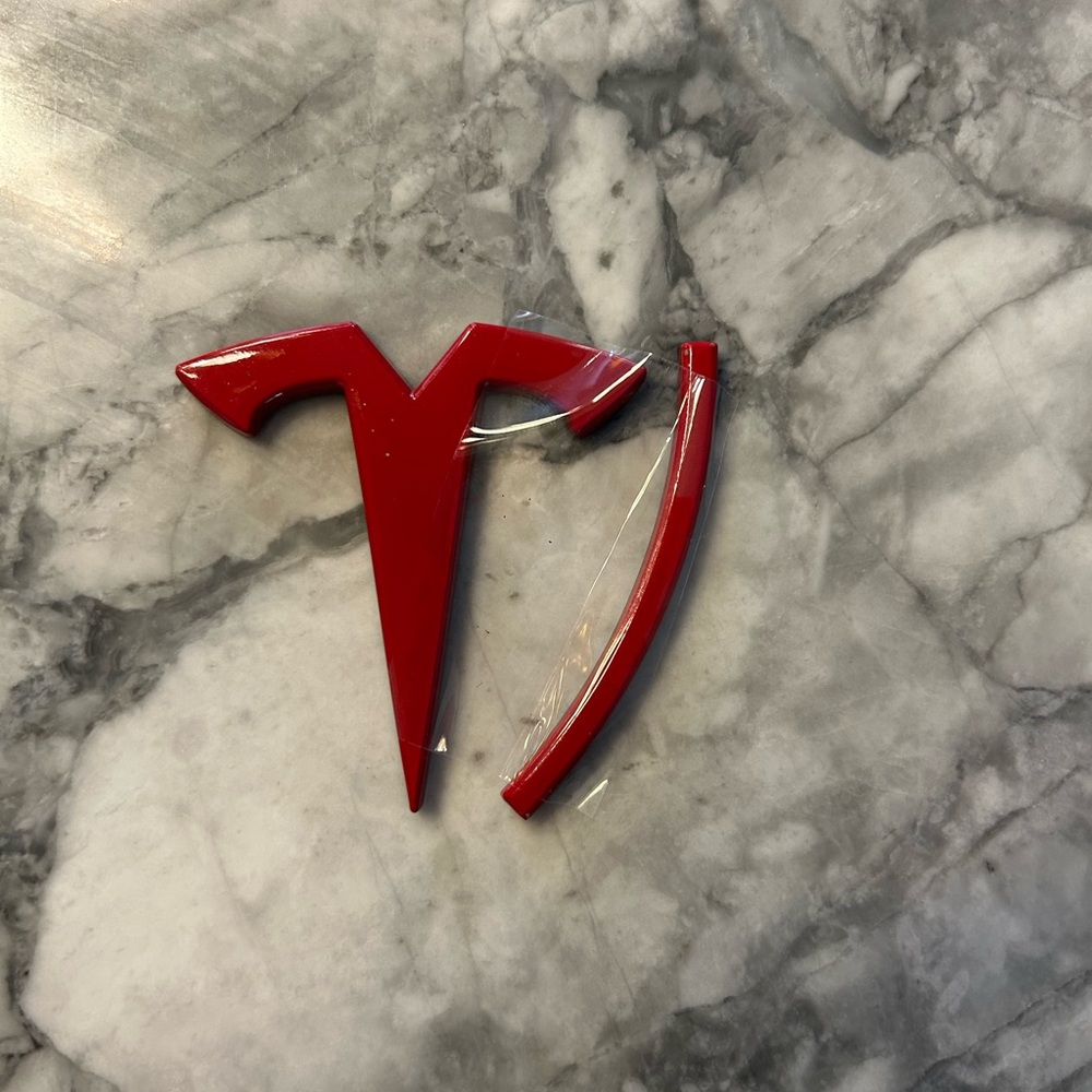 Tesla car emblem